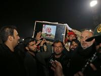 People carry the casket of Iraqi paramilitary chief Abu Mahdi al-Muhandis upon arrival at Ahvaz International Airport in southwestern Iran on January 5, 2020. A tide of mourners packed the streets of the Iranian city of Ahvaz Sunday to pay respects to top general Qasem Soleimani, days after he was killed in a US strike. HOSSEIN MERSADI / fars news / AFP