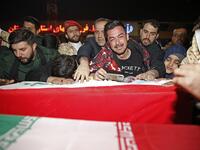 People mourn as they carry the casket of Iranian commander Qasem Soleimani upon arrival at Ahvaz International Airport in Tehran on January 5, 2020. A tide of mourners packed the streets of the Iranian city of Ahvaz Sunday to pay respects to top general Qasem Soleimani, days after he was killed in a US strike. HOSSEIN MERSADI / fars news / AFP