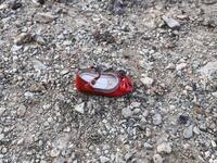 A child's shoe is pictured on January 8, 2020 at the scene of a Ukrainian airliner that crashed shortly after take-off near Imam Khomeini airport in the Iranian capital Tehran. Search-and-rescue teams were combing through the smoking wreckage of the Boeing 737 flight from Tehran to Kiev but officials said there was no hope of finding anyone alive. The vast majority of the passengers on the Ukraine International Airlines flight were non-Ukrainians, including 82 Iranians and 63 Canadians, officials said. Born