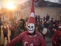 Masked revellers take part in a carnival procession through the south-western North Macedonian village of Vevcani, on January 13, 2020. The Vevcani carnival is 1.400 years old and is held every year on the eve of the feast of Saint Basil (January 14), which also marks the beginning of the New Year according to the Julian calendar, observed by the Macedonian Orthodox Church. Robert ATANASOVSKI / AFP