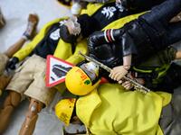 This picture taken on January 14, 2020 shows 1:6 scale action figures depicting characters involved in the Hong Kong protests, in Hong Kong. Intricately detailed Hong Kong protester figurines have become the latest must-have collectables as toy stores recreate the pro-democracy movement's street battles with police in their shop displays.  Philip FONG / AFP
