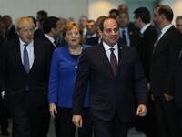 Egyptian President Abdul Fattah al-Sisi arrives for a family picture during a Peace summit on Libya at the Chancellery in Berlin, on January 19, 2020; back, from left: Britain's Prime Minister Boris Johnson and German Chancellor Angela Merkel. World leaders gather in Berlin. AFP