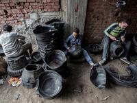 Labourers create rubber baskets from recycled tyre components at a rubber recycling workshop in the village of Mit al-Harun in Egypt's central Nile delta Gharbia Governorate, about 70 kilometres (43 miles) north of the capital, on January 14, 2020. Khaled DESOUKI / AFP