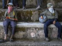 Children are tought to use weapons by the Regional Coordinator of Community Authorities (CRAC-PF) community police force at a basketball court in the village of Ayahualtempan, Guerrero State, Mexico, on January 24, 2020. The CRAC-PF vigilante group trains children as young as five so they can protect themselves from drug-related criminal groups operating in the area. Pedro PARDO / AFP
