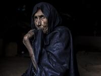 A woman from the small Nemadi(hunters) tribe in Eastern Mauritania is seen inside her families tent in the Loudeyatt Nemadi Camp on January 23, 2020. In the arid West African country of Mauritania, the way of life of the traditional group of hunters known as the Nemadi is slowly disappearing. JOHN WESSELS / AFP