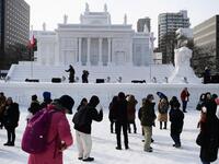 Organisers for this year's festival were forced to truck in an unprecedented amount of extra powder to build their signature sculptures after an unseasonably warm winter.  CHARLY TRIBALLEAU / AFP