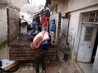 Syrians load their belongings onto a truck as they prepare to leave the town of Binnish in the northwestern province of Idlib, on February 4, 2020, amid an ongoing offensive by pro-regime forces. A Russian-backed Syrian government offensive against the country's last rebel enclave of Idlib has displaced more than half a million people in two months, according to the United Nations. The wave of displacement, which coincides with a biting winter, is one of the largest since the start of the Syrian war nearly 