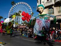Participants take part in the 136th Nice Carnival parade which celebrates this year the 'Fashion King' in Nice, southeastern France, on February 15, 2020. The carnival runs from February 15 to February 29, 2020. VALERY HACHE / AFP