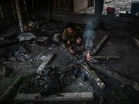 This photo taken on February 7, 2020 shows men preparing a meal after an overnight ceremony by Naga tribeswomen to bless the harvest in Satpalaw Shaung village, Lahe township in Myanmar's Sagaing region. A haunting refrain pierces the night as the tribeswomen of the Gongwang Bonyo, among the most isolated people in Myanmar, dance around a campfire to bless the harvest ahead. Ye Aung THU / AFP