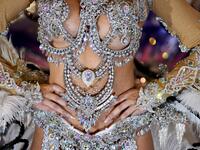 A participant prepares backstage before presenting her outfit during the Queen of the Carnival pageant contest in Santa Cruz de Tenerife, on the Spanish Canary island of Tenerife, on February 19, 2020. Gabriel BOUYS / AFP