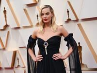 Margot Robbie stepped out in a vintage strapless navy Chanel dress