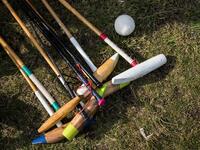 In this photograph taken on January 7, 2020, polo mallets and riding crops belonging to Linthoingambi Kangjei Lup polo club players lay on the grass before the start of their first match of the 15th Women's State Polo Tournament at the Mapal Kangjeibung (Polo Ground) in Imphal, the capital of the northeastern Indian state of Manipur. Laishram Thadoi's face is a picture of concentration as she adjusts her helmet and prepares to play in Manipur, the remote Indian state regarded as the birthplace of modern pol
