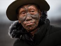This photo taken on February 8, 2020 shows Houn Ngo Kaw, 75, a tattooed Konyak tribeman, at Longwa village in Sagaing region of Myanmar, wedged in a semi-autonomous zone near the Indian border. People in the region subscribe to a complex patchwork of customs, intertwining their animist beliefs with warrior traditions that include striking tattoo designs, which can signify tribal identity, life accomplishments or the completion of a rite of passage. Ye Aung THU / AFP