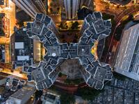 This aerial photograph taken on May 15, 2019 shows a housing estate (C) in Hong Kong. DALE DE LA REY / AFP