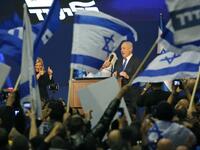 Israeli Prime Minister Benjamin Netanyahu and his wife Sara address supporters at the Likud party campaign headquarters in the coastal city of Tel Aviv early on March 3, 2020, after polls officially closed. Netanyahu claimed "a giant victory" in elections on March 3, boasting that his right-wing Likud party had defied "all expectations" in the country's third vote in less than a year. After exit polls by three networks forecast that Likud and its allies were on track to win 59 parliamentary seats -- two sho