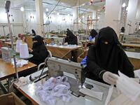 Yemeni women make face masks at a textile factory in the capital Sanaa on March 16, 2020. More than a decade after it shut down, 20 women have brought back to life Yemen's oldest industrial factory to manufacture what could save many lives amid a global pandemic: masks. Mohammed HUWAIS / AFP