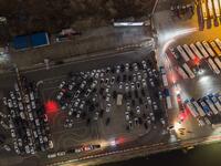 A photo taken on March 21, 2020 shows an aerial view of a drive-through cinema in Seoul. Box office numbers in South Korea -- which has 8,897 confirmed virus cases -- have plummeted in recent weeks due to the epidemic, with authorities urging the public to avoid large crowds. Ed JONES / AFP