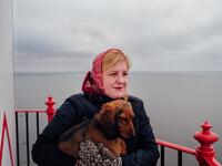 Elly Karjam, who is in charge of the lighthouse of the island, poses on November 20, 2019 on Kihnu island in the Baltic Sea, 10 kilometres (six miles) off the coast of Estonia. Steeped in folk traditions, Kihnu's historic way of life however is now threatened as economic hardship drives more and more islanders away in search of work. Alessandro RAMPAZZO / AFP