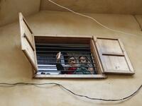 Lebanese youths sit at a barred window during confinement at home due to the COVID-19 pandemic, in the historic part of the southern coastal city of Sidon (Saida), on April 6, 2020. Lebanon's President called on international donors to provide financial assistance to the crisis-hit country as it grapples with a severe economic downturn compounded by the novel coronavirus pandemic. JOSEPH EID / AFP