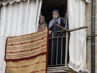 Lebanese women stand at their balcony during confinement at home due to the COVID-19 pandemic, in the historic part of the southern coastal city of Sidon (Saida), on April 6, 2020. Lebanon's President called on international donors to provide financial assistance to the crisis-hit country as it grapples with a severe economic downturn compounded by the novel coronavirus pandemic. JOSEPH EID / AFP