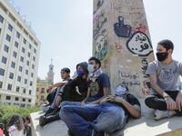 A handout picture released by the official Syrian Arab News Agency (SANA) on May 1, 2020, shows smoke billowing above buildings in Syria's central city of Homs. SANA said that the explosions ringing out of a Syrian army position in Homs resulted from a "human error during the transport of some ammunition, which led to human and material losses", while the Syrian Observatory for Human Rights, a Britain-based war monitor relying on sources inside Syria, said Israeli air strikes hit a missile depot belonging t