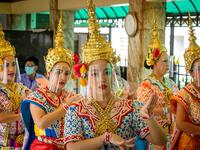 Traditional Thai dancers wearing protective face shields perform at the Erawan Shrine, which was reopened after the Thai government relaxed measures to combat the spread of the COVID-19 novel coronavirus, in Bangkok on May 4, 2020. Thailand began easing restrictions related to the COVID-19 novel coronavirus on May 3 by allowing various businesses to reopen, but warned that the stricter measures would be re-imposed should cases increase again. Mladen ANTONOV / AFP