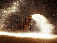 A Palestinian youth swings a homemade sparkler firework as people celebrate on a night of the Muslim holy month of Ramadan in Rafah refugee camp, in the southern Gaza Strip, on May 4, 2020. MAHMUD HAMS / AFP