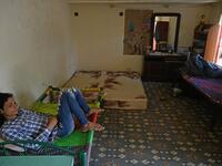 In this picture taken on May 8, 2020, member of the transgender community Adnan Ali (L) rests inside a shelter house in Bari Imam neighbourhood of Islamabad. Transgender people in the country are known as "khawajasiras" or "hijras" -- an umbrella term denoting a third sex that includes transgender women and cross-dressers. Pakistan became one of the first countries in the world to legally recognise a third sex in 2009 and began issuing transgender passports from 2017. Aamir QURESHI / AFP