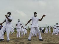 Nurses assigned to the Infectious Diseases Unit (IDU) at the Kenyatta University Hospital dance during a Zumba class held at the hospital compound in Nairobi, on May 17, 2020. Coinciding with the morning shift rotation the class, aimed to offer some respite to nurses charged with the management of patients infected with COVID-19 coronavirus, was organised by the Nursing Council of Kenya (NCK) and the Kenyatta Univesity Teaching, Refferal and Research Hospital in the Kenyan capital. TONY KARUMBA / AFP