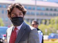 In this file photo Canadian Prime Minister Justin Trudeau arrives on Parliament Hill to attend a sitting of the Special Committee on the COVID-19 Pandemic, May 20, 2020 in Ottawa, Canada. Beijing's linking of its detention of two Canadians in China to the arrest of a Chinese executive in Vancouver shows it doesn't understand the meaning of an independent judiciary, Prime Minister Justin Trudeau said May 21, 2020. China detained former Canadian diplomat Michael Kovrig and businessman Michael Spavor in Decemb