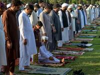 Muslims offer Eid al-Fitr prayers in Peshawar on May 24, 2020. Muslims around the world began marking a sombre Eid al-Fitr on May 24, many under coronavirus lockdown, but lax restrictions offer respite to worshippers in some countries despite fears of skyrocketing infections. Abdul MAJEED / AFP
