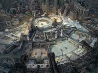 This picture taken on May 24, 2020 during the early hours of Eid al-Fitr, the Muslim holiday which starts at the conclusion of the holy fasting month of Ramadan, shows an aerial view of the Grand Mosque and Kaaba in the centre of Saudi Arabia's holy city of Mecca. Saudi Arabia began a five-day, round-the-clock curfew from May 23 after COVID-19 coronavirus infections more than quadrupled since the start of Ramadan to around 68,000 -- the highest in the Gulf. STR / AFP