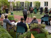Guests of Zeitgeist Hotel listen to singers Monika Medek and Dagmar Dekanovsky and the Camerata Carnutum orchestra, during a window concert (Fensterkonzert) in Vienna on May 30, 2020, as hotels have reopened in Austria amid the novel coronavirus pandemic. JOE KLAMAR / AFP