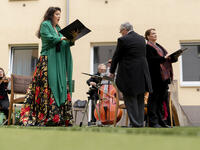 Monika Medek (L) and Dagmar Dekanovsky (R) and the Camerata Carnutum orchestra, perform for guests of Zeitgeist Hotel during a window concert (Fensterkonzert) in Vienna on May 30, 2020, as hotels and cultural events have reopened in Austria amid the novel coronavirus pandemic. JOE KLAMAR / AFP