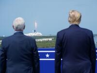 US President Donald Trump watches the SpaceX Falcon 9 rocket carrying the SpaceX Crew Dragon capsule, with astronauts Bob Behnken and Doug Hurley, lifts off from Kennedy Space Center in Florida on May 30, 2020. Trump travels to Kennedy Space Center in Florida to watch the launch of the manned SpaceX Demo-2 mission to the International Space Station. MANDEL NGAN / AFP