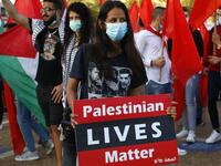 Protesters gather in Tel Aviv's Rabin Square on June 6, 2020, to denounce Israel's plan to annex parts of the occupied West Bank. Israeli Prime Minister Benjamin Netanyahu has vowed to forge ahead with annexing settlements and the Jordan Valley, in line with the peace proposals unveiled in January by US President Donald Trump. The plan has been angrily rejected by the Palestinians, who say they were not consulted on proposals they see as capitulating to Israeli demands. JACK GUEZ / AFP