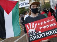 Protesters gather in Tel Aviv's Rabin Square on June 6, 2020, to denounce Israel's plan to annex parts of the occupied West Bank. Israeli Prime Minister Benjamin Netanyahu has vowed to forge ahead with annexing settlements and the Jordan Valley, in line with the peace proposals unveiled in January by US President Donald Trump. The plan has been angrily rejected by the Palestinians, who say they were not consulted on proposals they see as capitulating to Israeli demands. JACK GUEZ / AFP