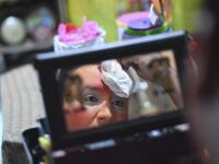 Chimbombita clown puts on make up before taking to the streets to beg for money to survive the crisis caused by the new coronavirus in Villa Nueva, 20 km south Guatemala City, on June 10, 2020, as clowns have been unable to work due to restrictions to prevent the spread of the COVID-19. Johan ORDONEZ / AFP