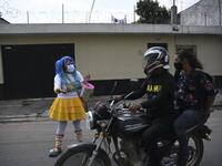 A clown begs for money to survive the crisis caused by the new coronavirus in Villa Nueva, 20 km south Guatemala City, on June 10, 2020, as clowns have been unable to work due to restrictions to prevent the spread of the COVID-19.    Johan ORDONEZ / AFP