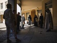 Tour guide Mike Anderson takes visitors on May 30 ,2020 on a 'plague walk', taking them around sites in Stockholm's old town related to pandemics of the plague in the 14th and 18th century, and an outbreak of cholera that hit the city in the mid-19th century. Jonathan NACKSTRAND / AFP