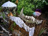 This picture taken on February 20, 2020 shows bamboo cages which cover bodies at a cemetery where Bali's Trunyanese people hold open-air burials - before restrictions were implemented due to the COVID-19 coronavirus - near the village of Trunyan in Bangli Regency, near Lake Batur on Bali island. SONNY TUMBELAKA / AFP