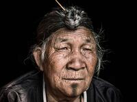 The travel photographer travelled deep into the heart of mountainous Nagaland, India, to capture the striking images. The man above wears a jacket as his long, grey hair is pulled into a bun sitting at the top of his head. (Mediadrumimages/ Trevor Cole)