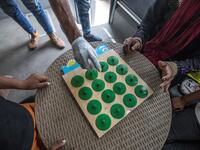 Homeless children play an educational game with a social worker inside one of the mobile units run by the Egyptian authorities and used as part of the "Atfal bala ma'wa" (Children without a home) social program, in the capital Cairo's Abbasia district on June 22, 2020. Khaled DESOUKI / AFP