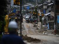 Debris litter a village following heavy rains and flooding in the village of Gero, Gifu prefecture on July 9, 2020. Japanese emergency services and troops were scrambling to reach thousands of homes cut off by devastating flooding and landslides that have killed dozens and caused widespread damage. Philip FONG / AFP