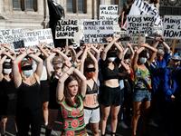 Protesters perform a dance inspired by the Chilean feminist group "Las Tesis" during a demonstration called by feminist movements in front of the city hall in Paris, on July 10, 2020, to denounce the nomination of French Interior Minister, facing rape accusations and French Justice Minister who criticised the #MeToo movement against sexual harassment. Thomas COEX / AFP