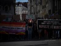Protesters hold signs and banners as they take part in a demonstration called by feminist movements in Nantes, western France, on July 10, 2020, to denounce the nomination of French Interior Minister, facing rape accusations and French Justice Minister who criticised the #MeToo movement against sexual harassment. LOIC VENANCE / AFP