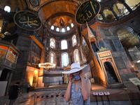 A tourist visits the inside of Hagia Sophia on July 10, 2020, in Istanbul, before a top Turkish court revoked the sixth-century Hagia Sophia's status as a museum, clearing the way for it to be turned back into a mosque. The Council of State, the country's highest administrative court which on July 2 debated a case brought by a Turkish NGO, cancelled a 1934 cabinet decision and ruled the UNESCO World Heritage site would be reopened to Muslim worshipping. The sixth-century Istanbul building -- a magnet for to