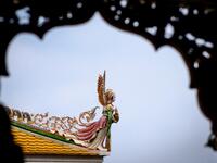 This photograph taken on July 14, 2020 shows a detail on the roof of the Wat Pariwat Buddhist temple in Bangkok. Wat Pariwat, also known as "the David Beckham Temple", is decorated with statues of superheroes and comic characters as well as mythical and imaginary creatures. A golden-plated sculpture of the English football player holding the base of a Buddha statue in one of the buildings gives the temple its nickname.
