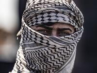 A man works at a makeshift refinery using burners to distill crude oil in the village of Bishiriya in the countryside near the town of Qahtaniya west of Rumaylan (Rmeilan) in Syria's Kurdish-controlled northeastern Hasakeh province, on July 19, 2020. DELIL SOULEIMAN / AFP