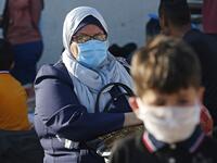 Palestinians wait to cross to the Egyptian side of Rafah border crossing after months of closure due to the coronavirus pandemic in the southern Gaza Strip, on August 11, 2020. SAID KHATIB / AFP